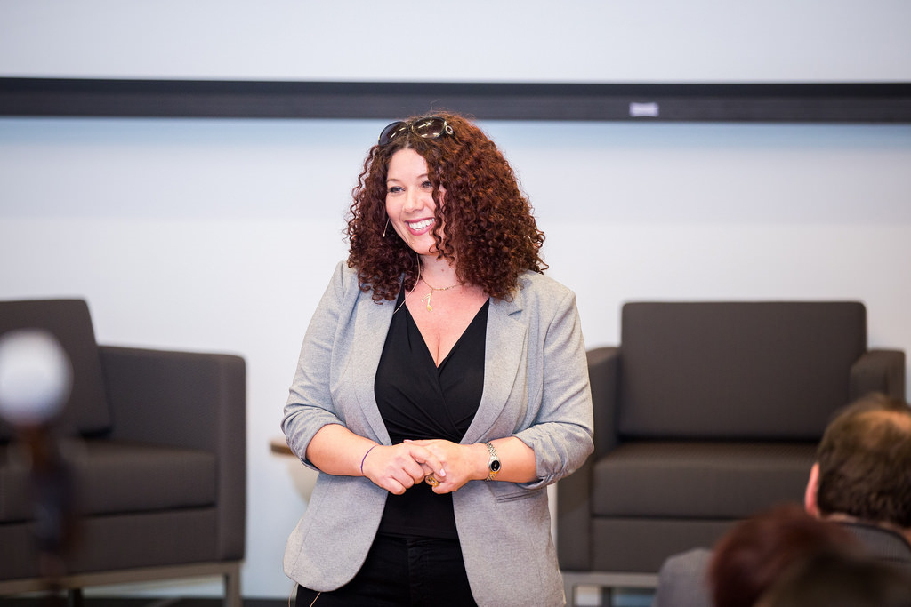 Kim speaking at a conference