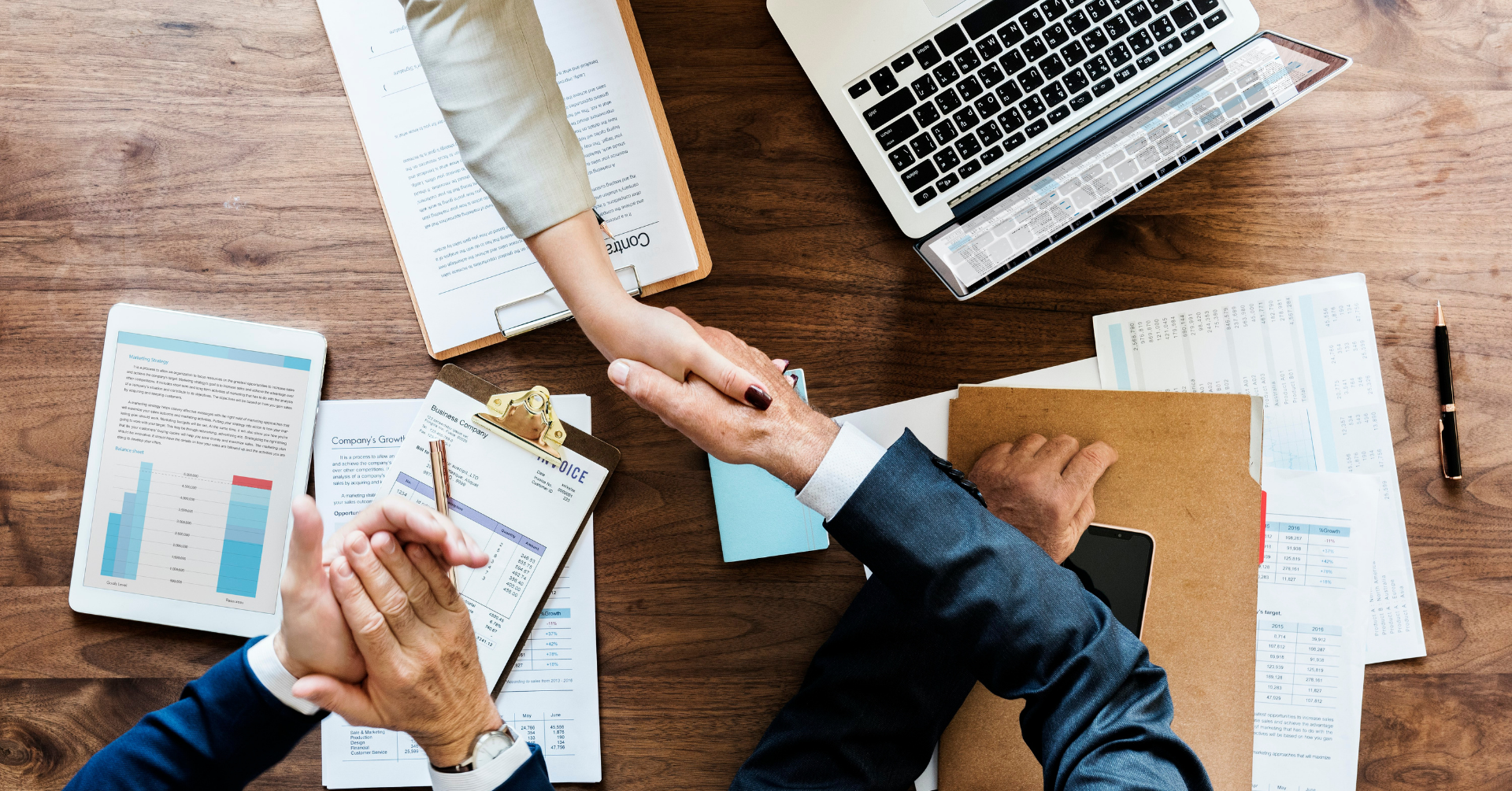 Overhead image of two business people shaking hands