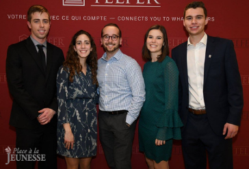 Students in front of a Telfer branded background