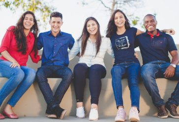 A group of young adults sitting together