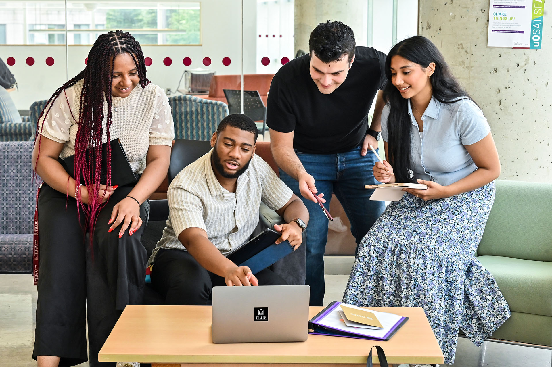 Students looking at a computer