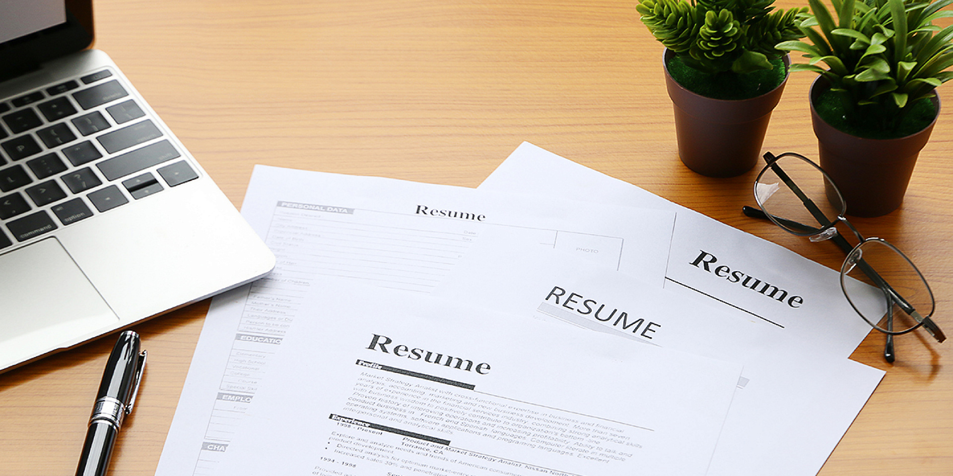 Pile of resumes on a table