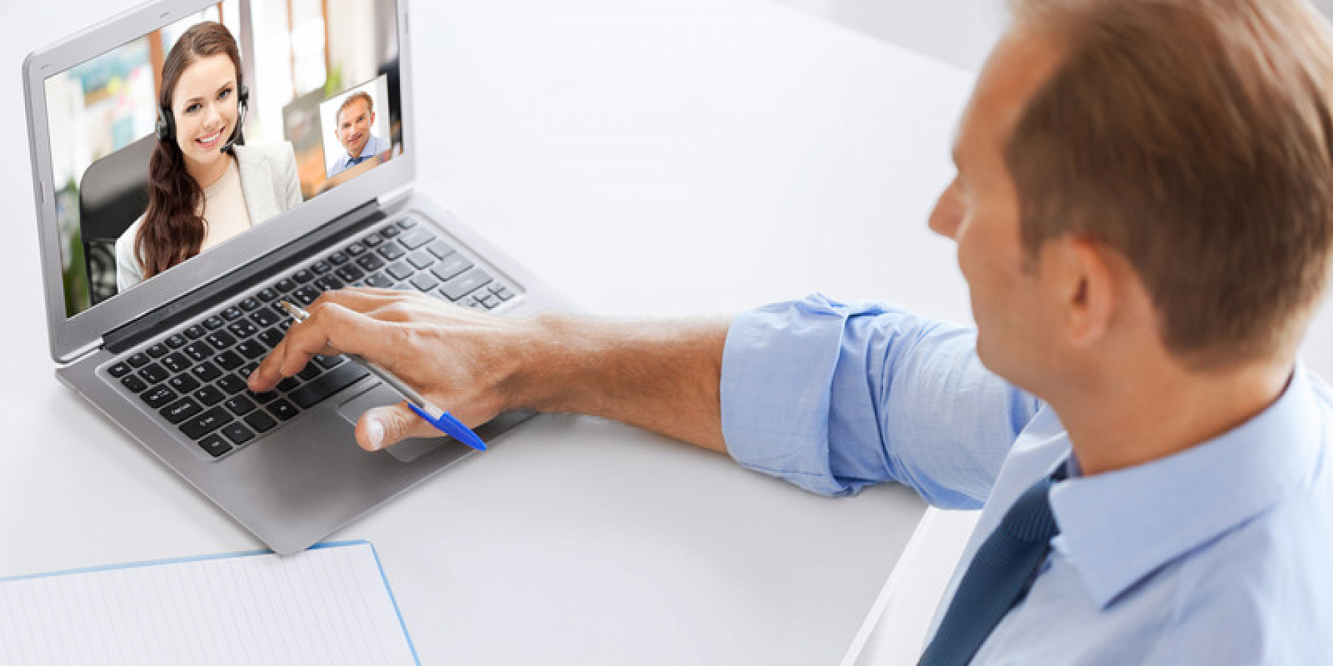 Man in a dress shirt on a video call with a women