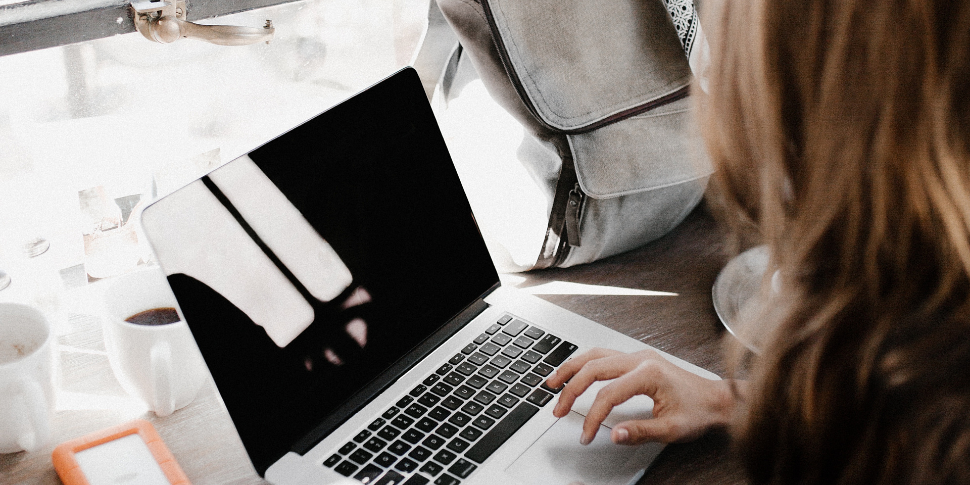 Women working with her laptop.