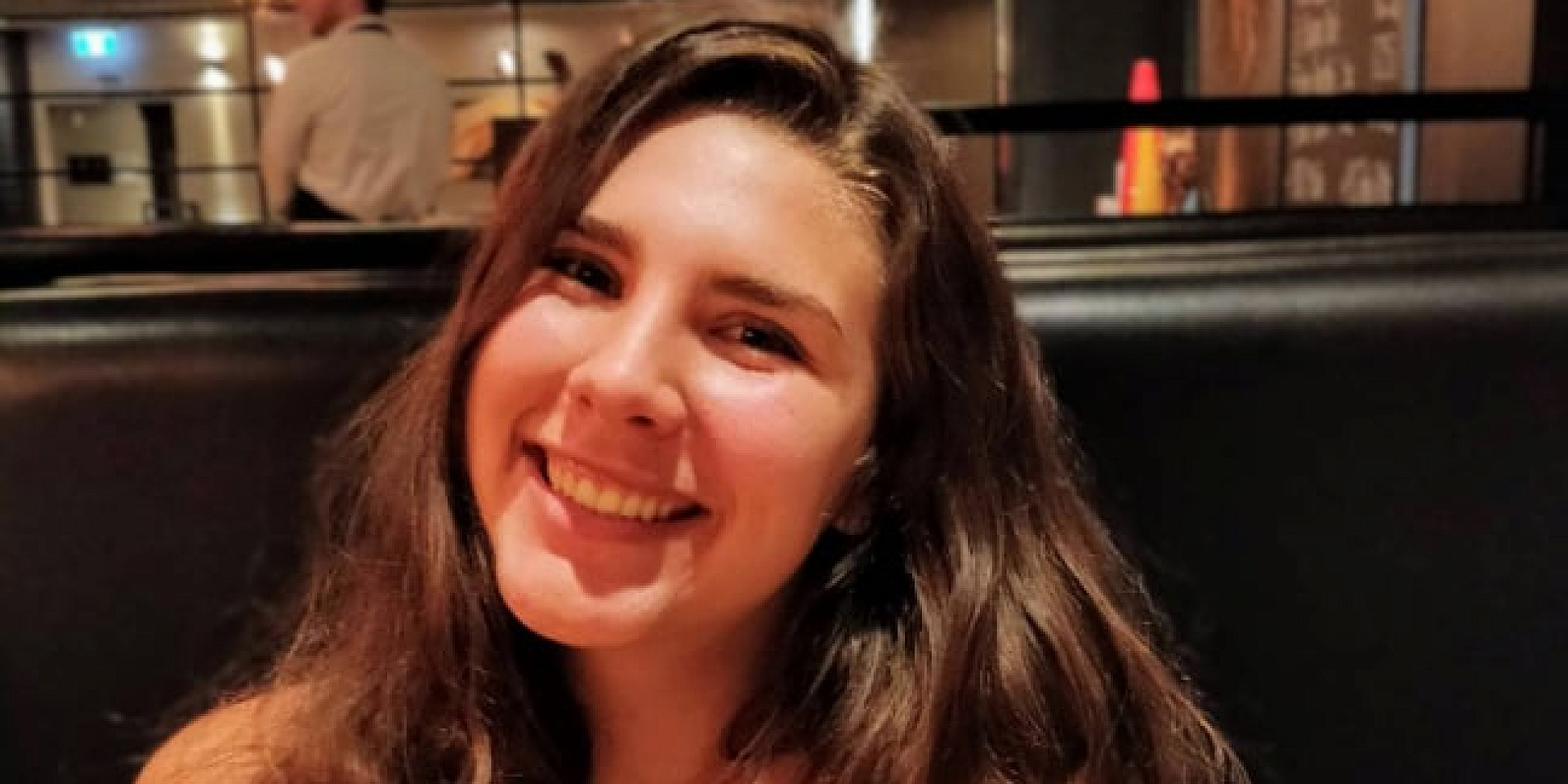 Veronica Fusco Hitchlock smiling in a restaurant.