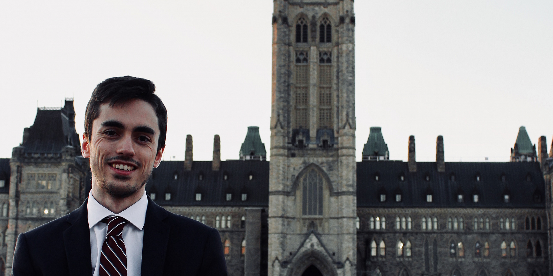 Charles Doray in front of the Parliament of Canada.