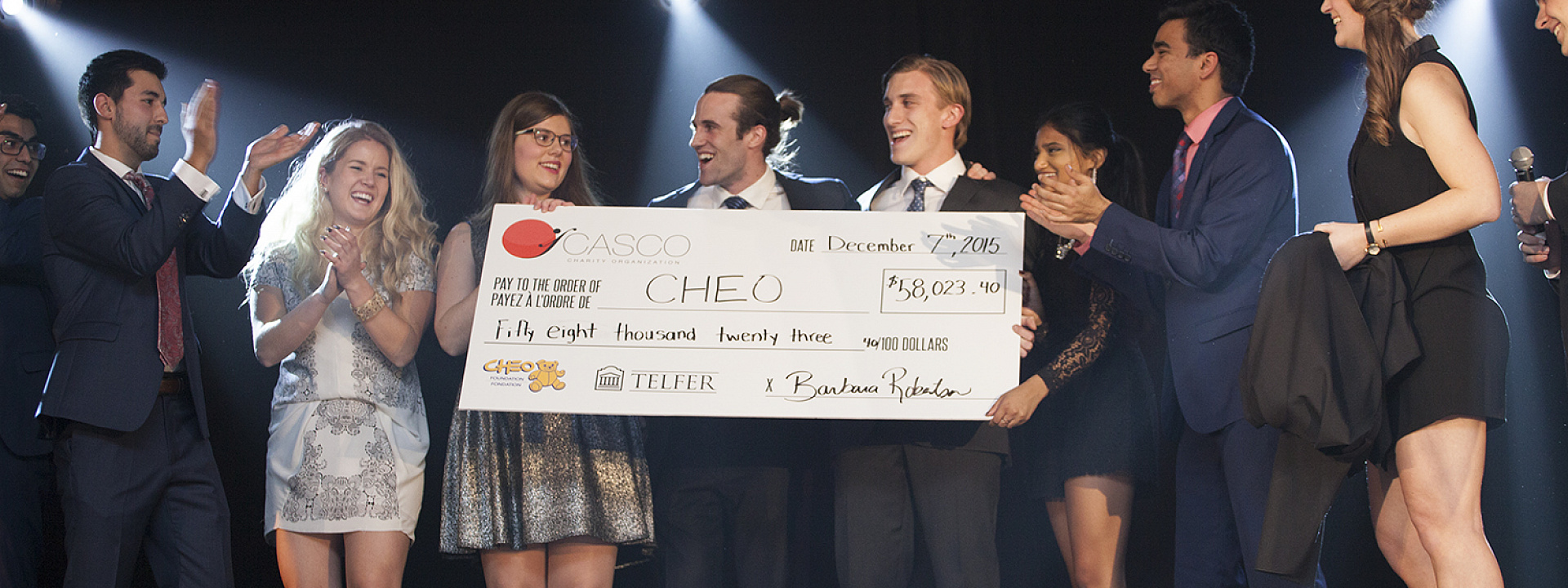 Students with cheque