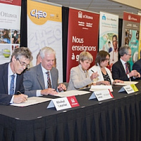 Photo of representatives signing the agreement
