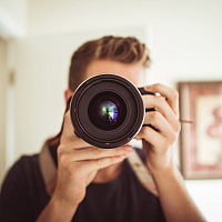 Person holding a camera