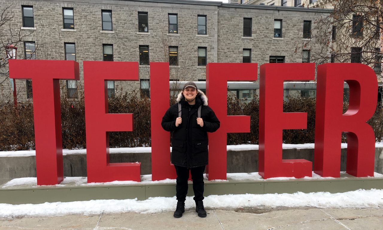 Ryan Lloy in front of Telfer sign