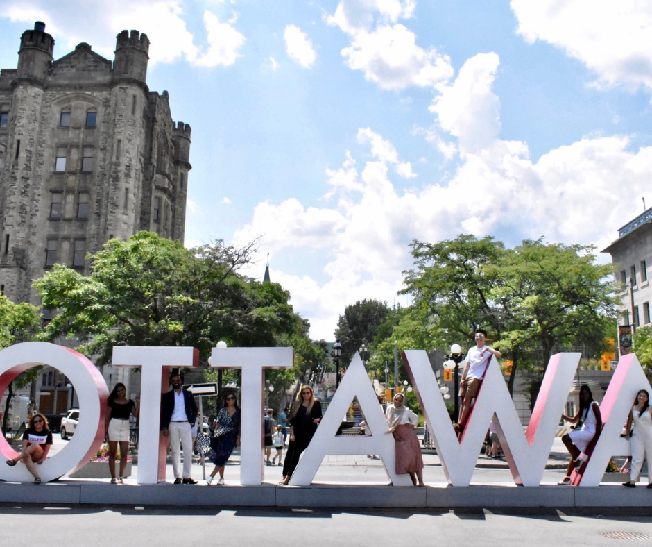 students in front of OTTAWA giant letters