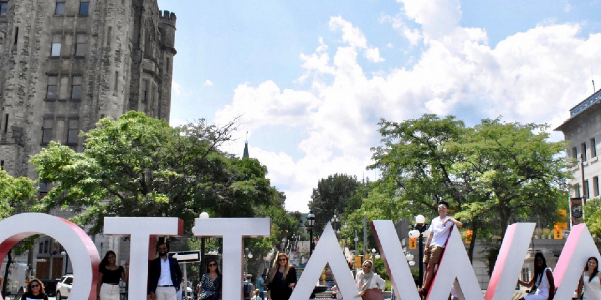 Students in front of Ottawa giant letters