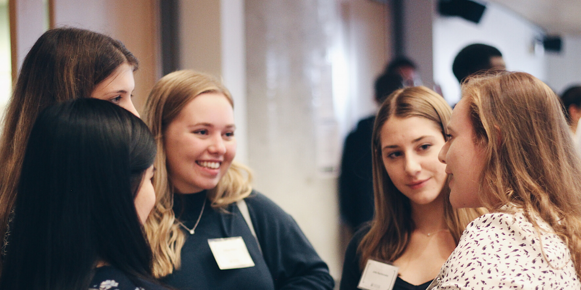 Students speaking at a networking event