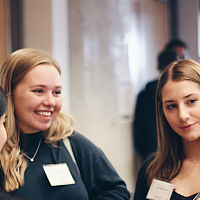 Students speaking at a networking event