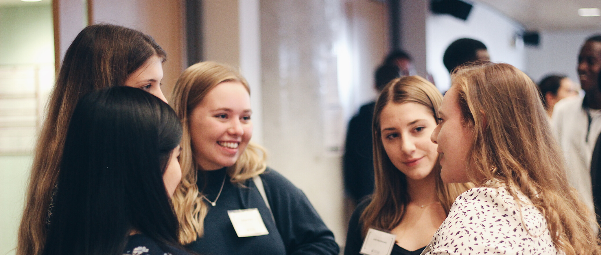 Students speaking at a networking event