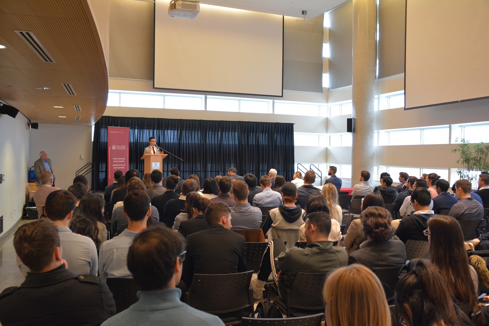 student speaking on podium