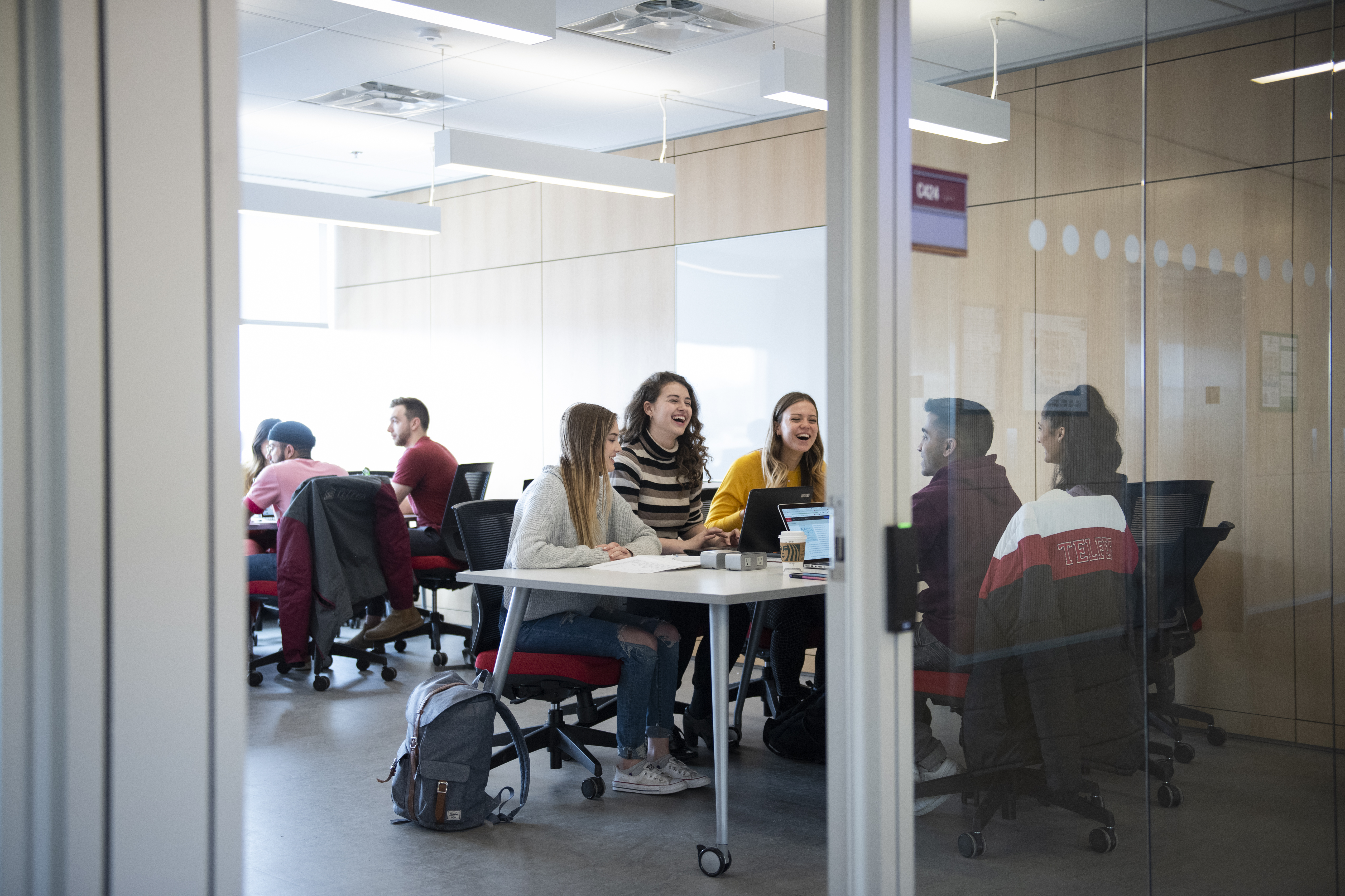 Telfer students studying in a study room in the Learning Crossroads (CRX)