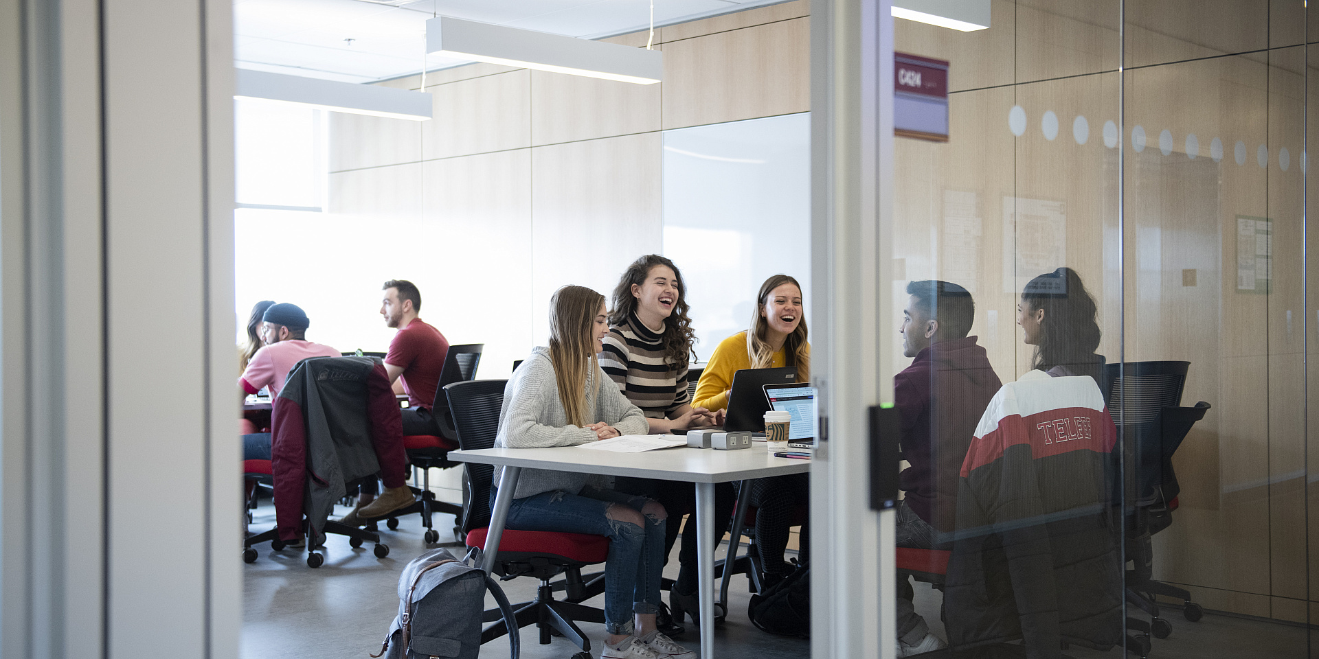 Telfer students studying in a study room in the Learning Crossroads (CRX)