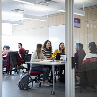 Telfer students studying in a study room in the Learning Crossroads (CRX)