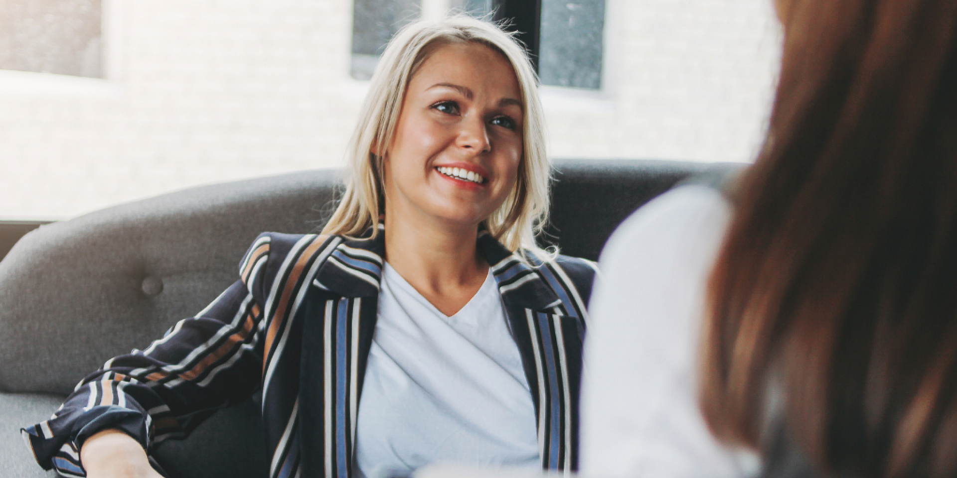 A person sitting talking to someone off camera 