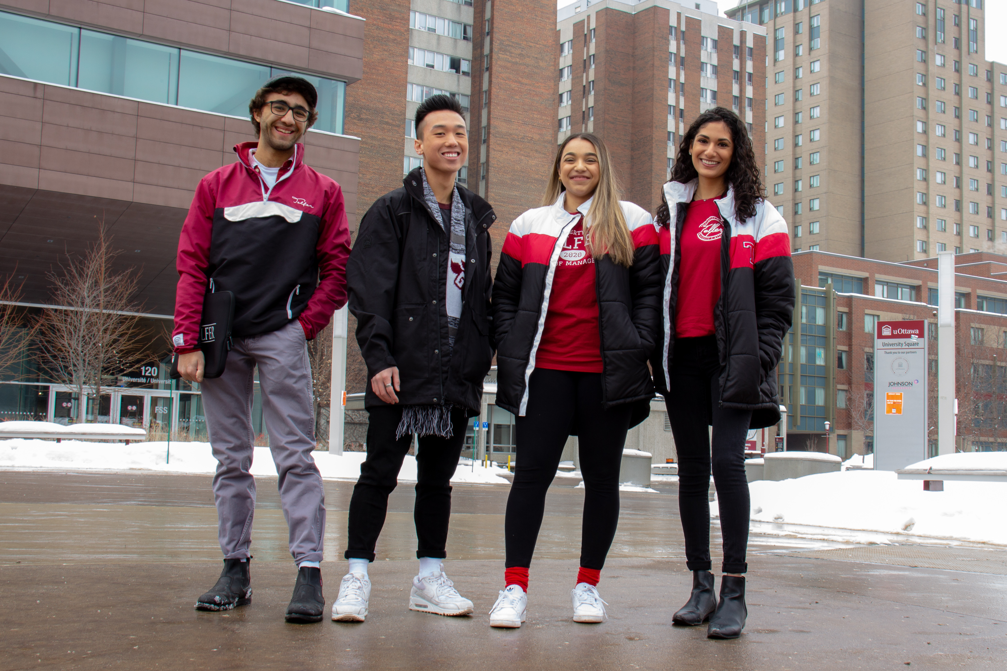 students on campus, outdoor, snow, smiling