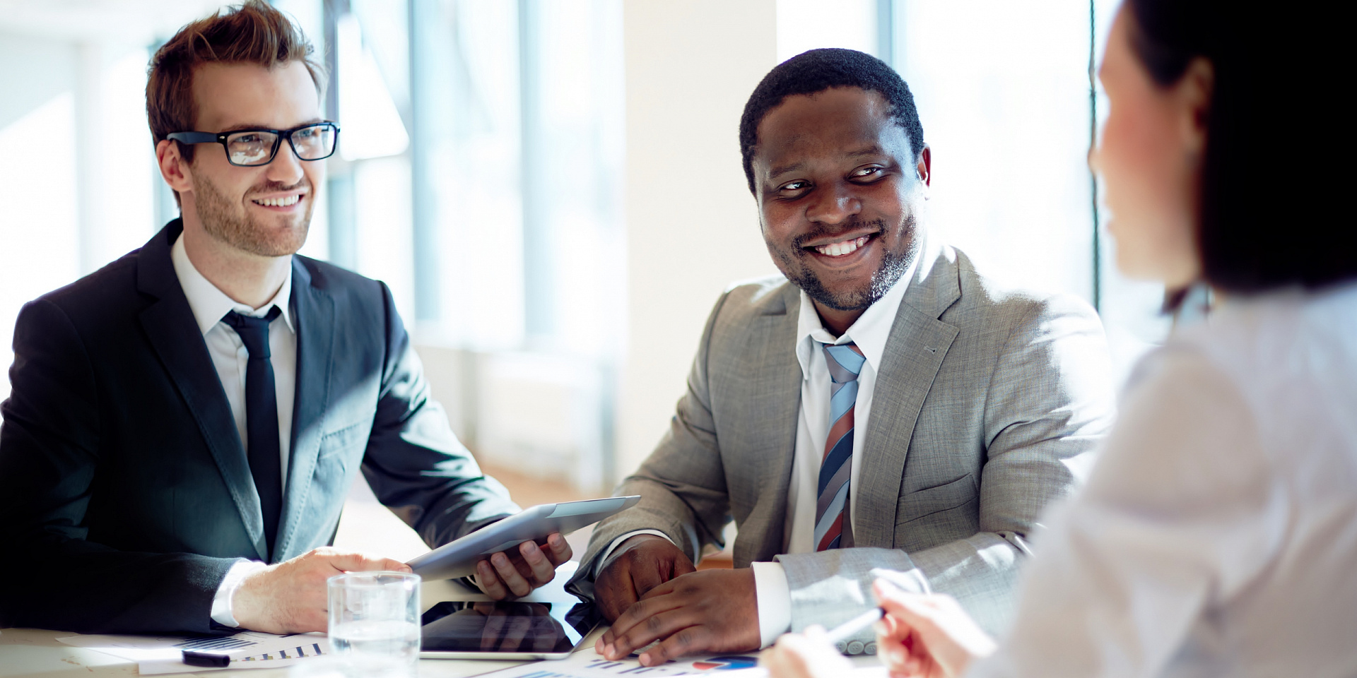 Three business professionals meeting together.