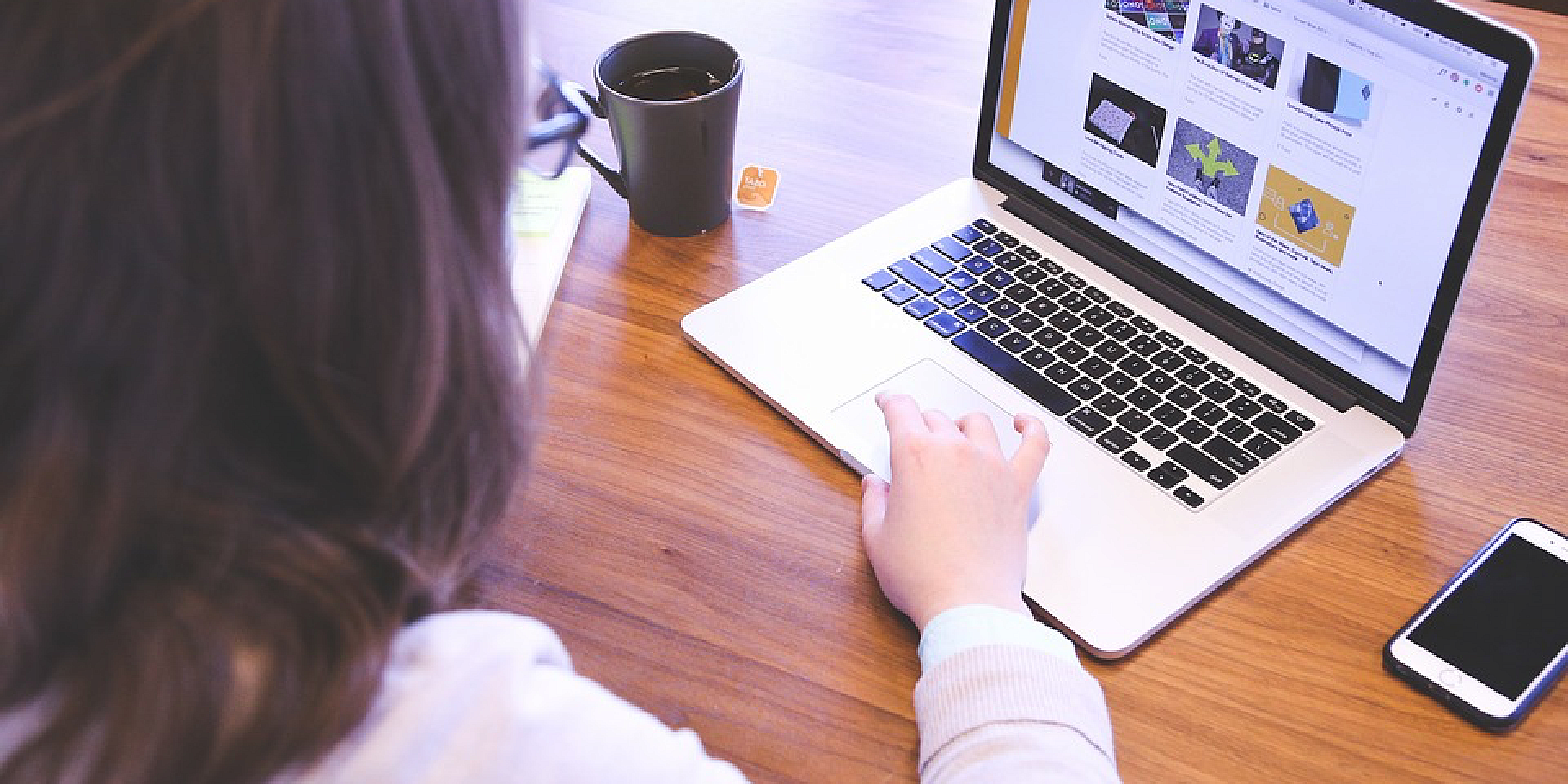 Woman using a laptop.