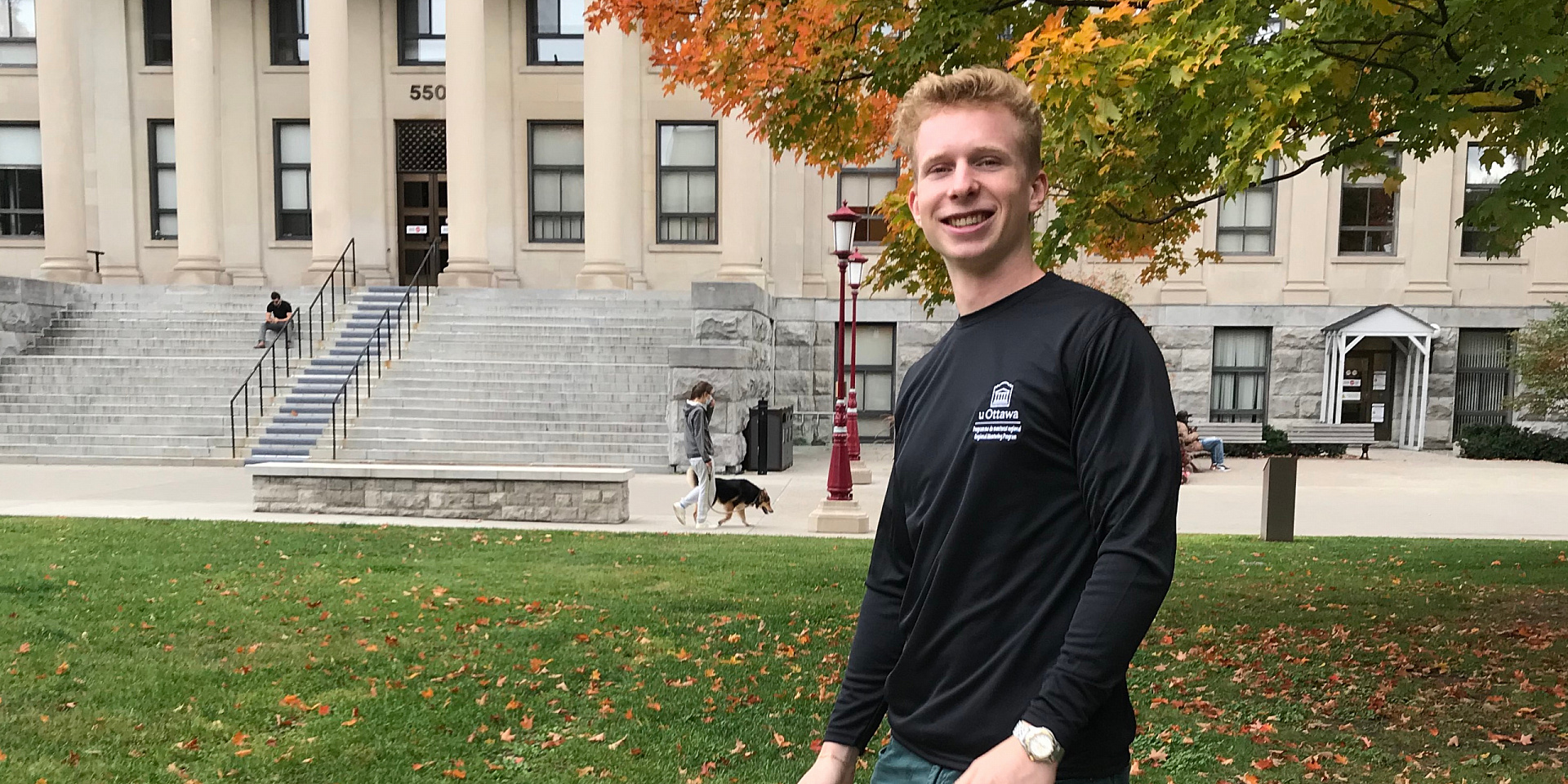 Lukas Wirz-Endrys in a black shirt in front of Tabaret Hall