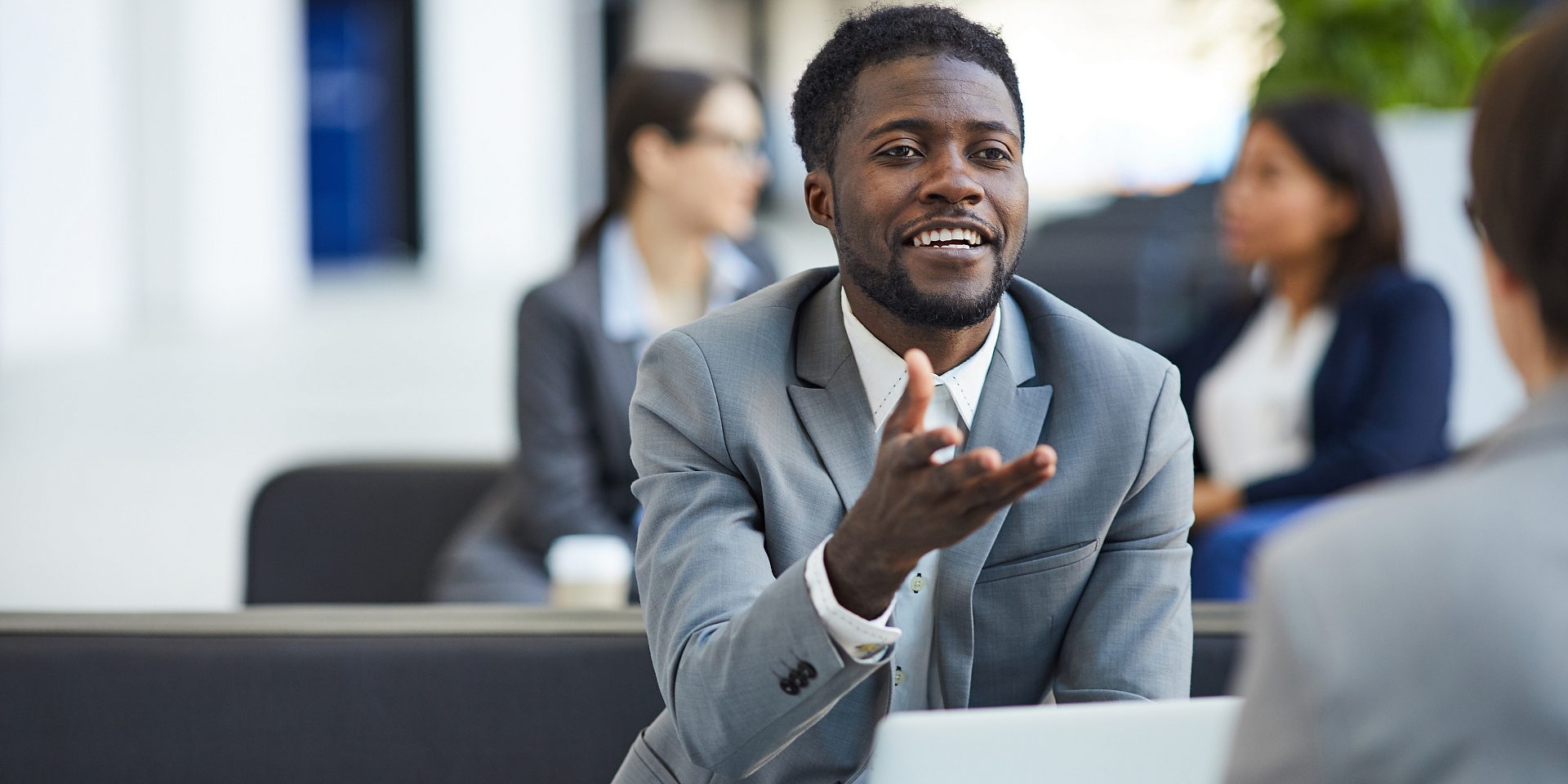 black business man talking smiling in workplace