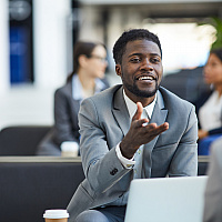 black business man talking smiling in workplace