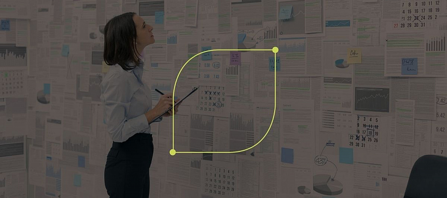 Businesswoman looking at newspaper on wallpaper
