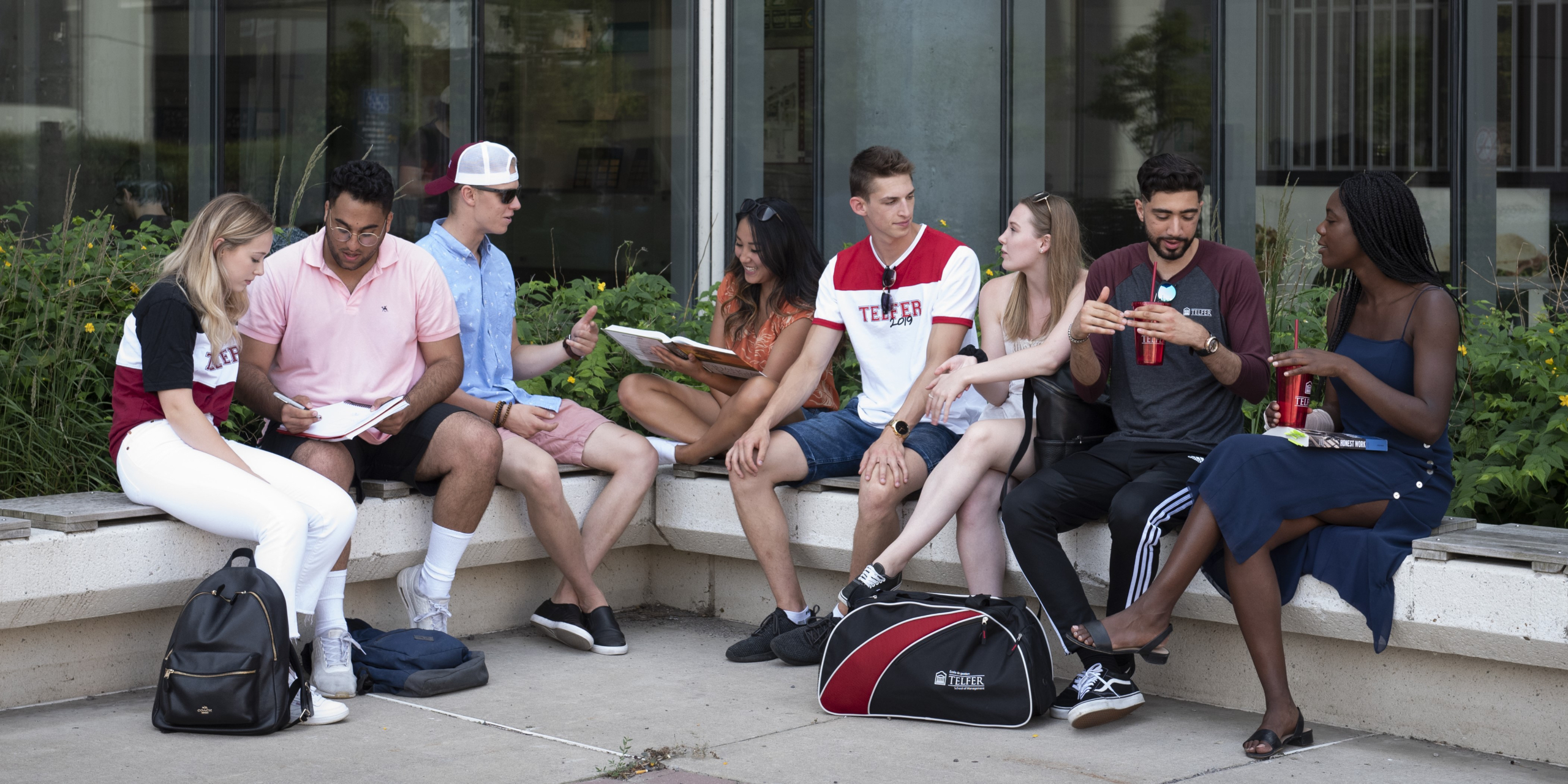 Students sitting outside talking