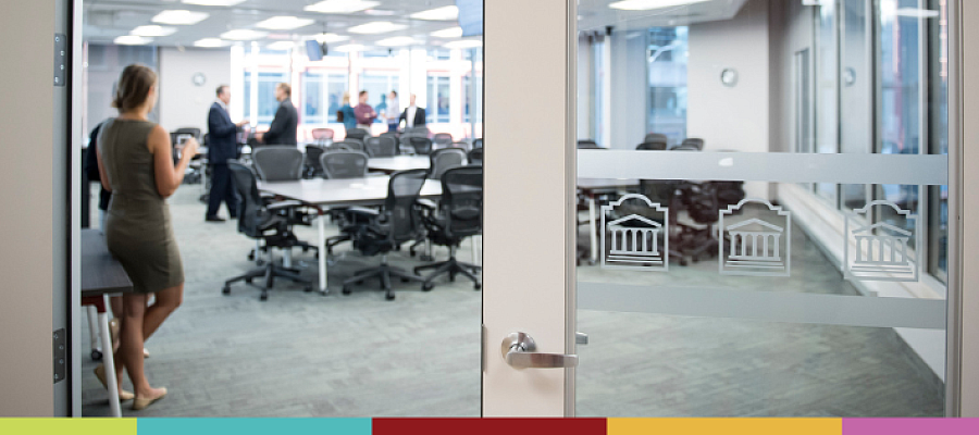Participants are chatting together in a classroom at Telfer's Executive Campus.