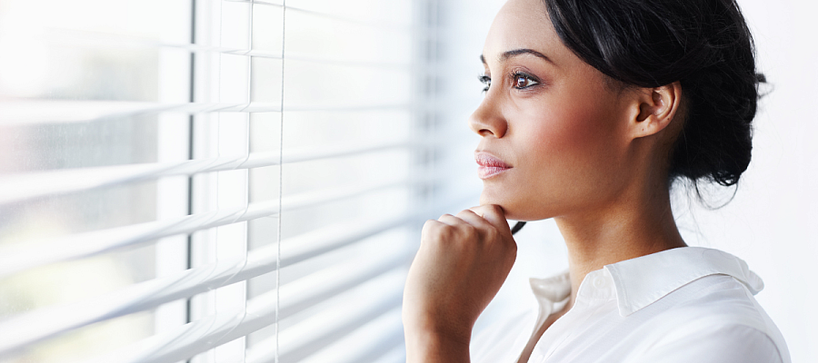 woman looking out window