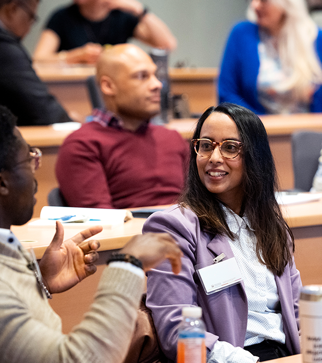 People talking in a classroom