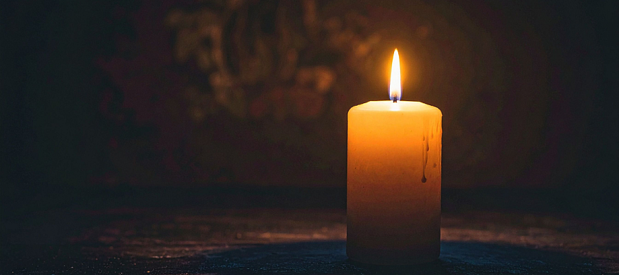 candle lit in a dark room