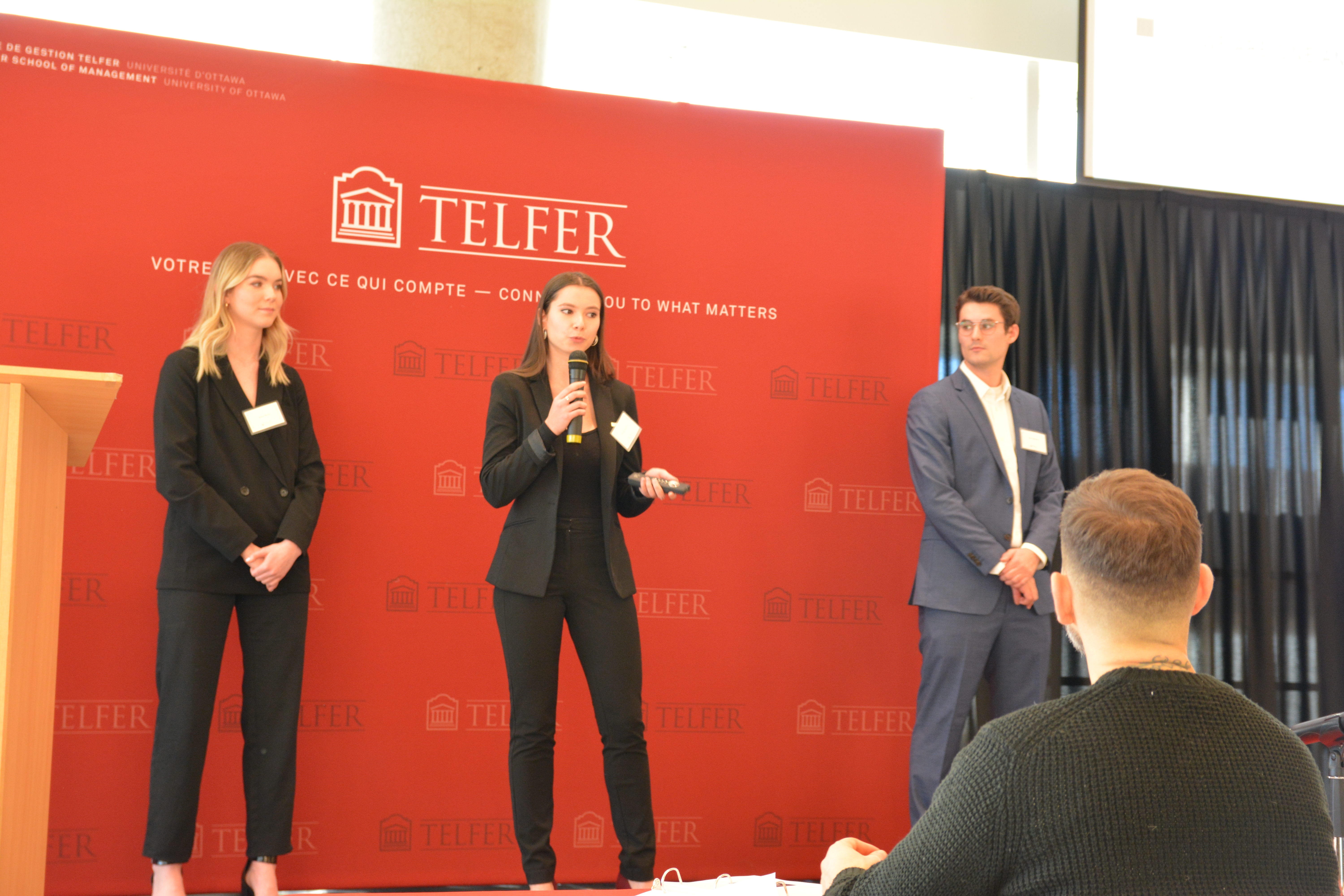 Students speaking on stage