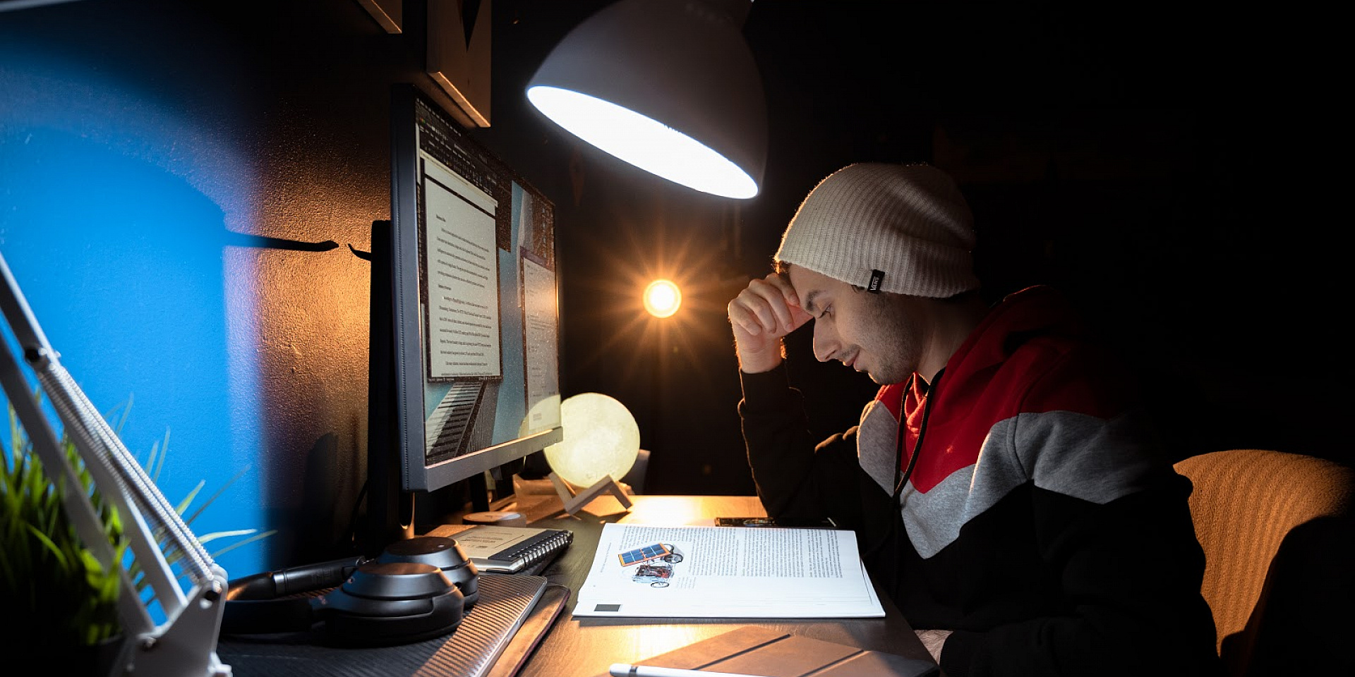 Telfer student sitting at a desk at home looking at their study notes