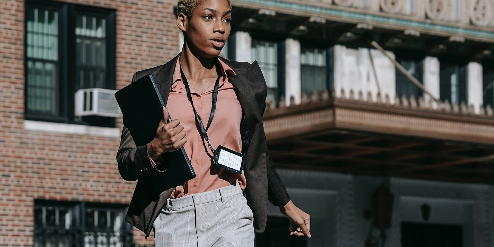 Young woman entrepreneur walking down the street