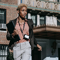 Young woman entrepreneur walking down the street