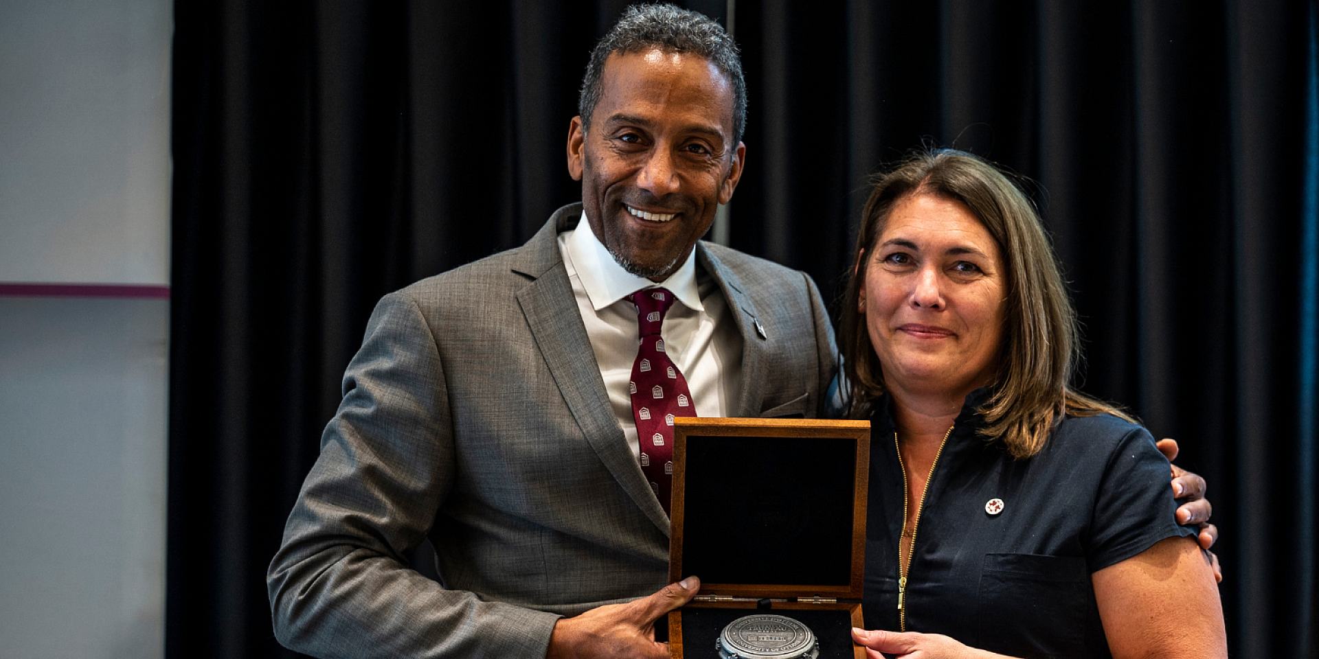 Anie Rouleau and Stéphane Brutus holding the R. Trudeau Medal