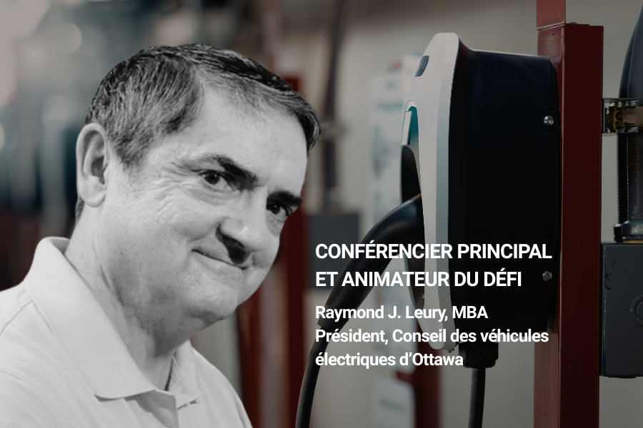 Portrait de Raymond J. Leury debout près d’une borne de recharge pour véhicules électriques, identifié comme conférencier principal et animateur du défi.