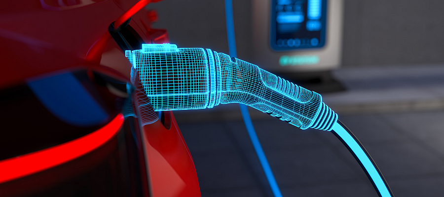 Close-up of an electric vehicle charging cable plugged into a car, representing clean energy and sustainable transportation.