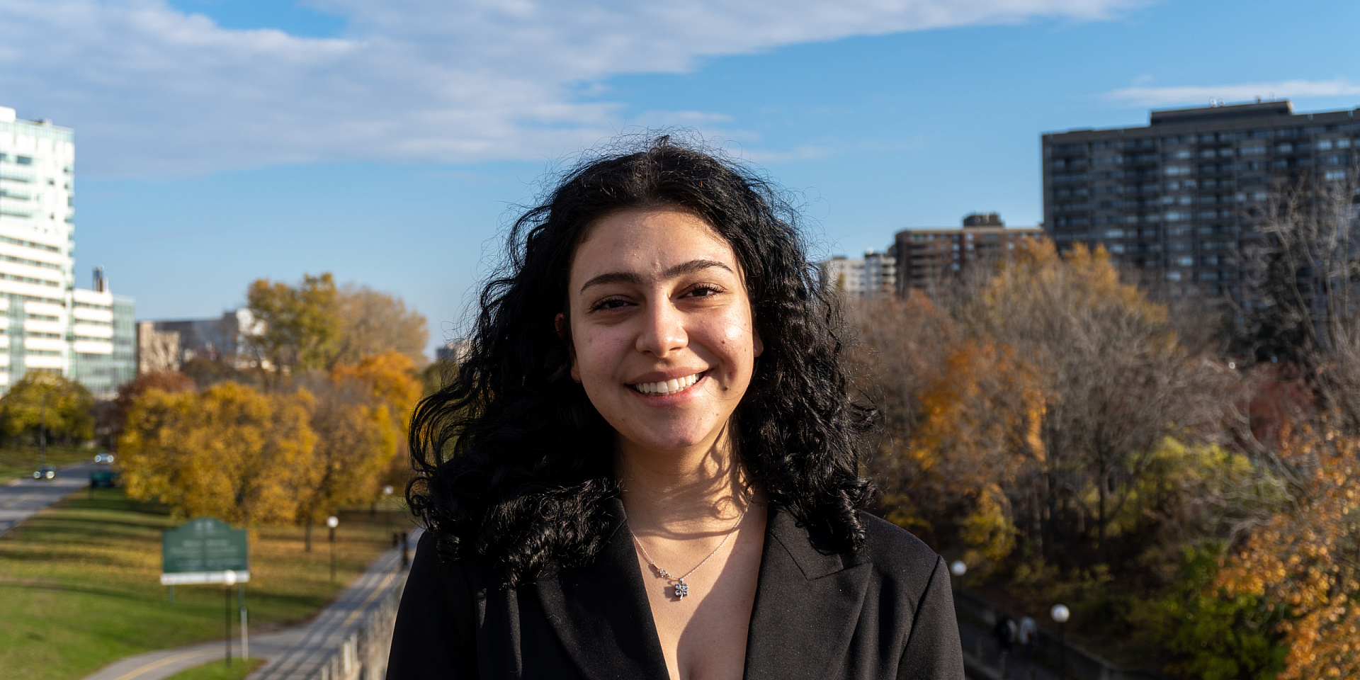 Sara Sabbagh wearing a black jacket outside.