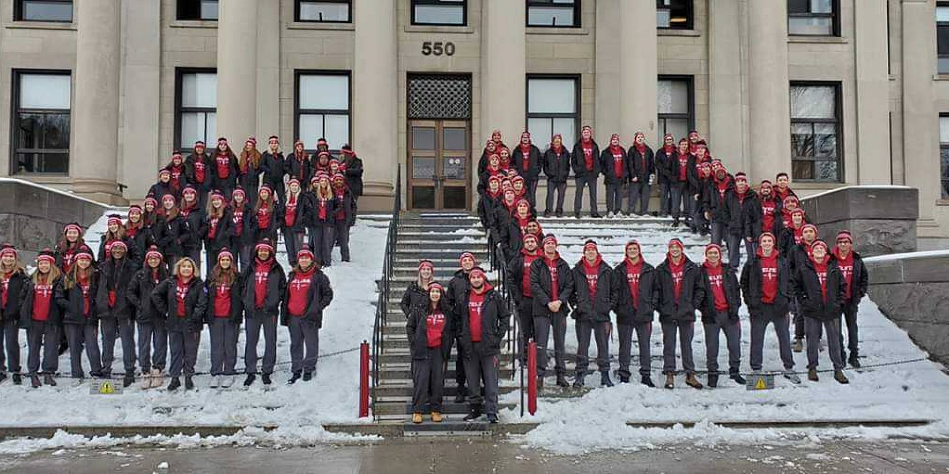 jdc group photo on building steps