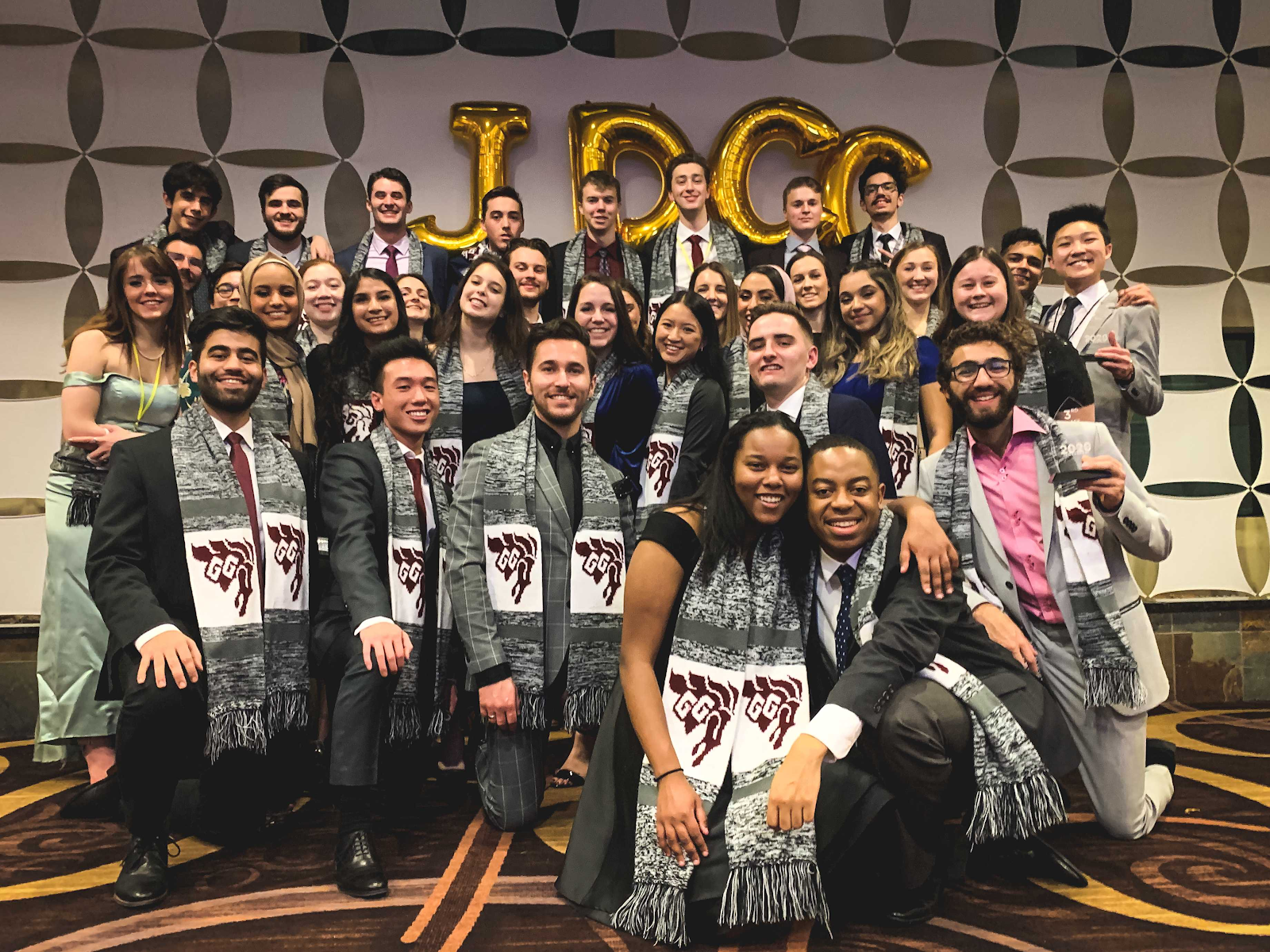 jdcc group photo with letter balloons