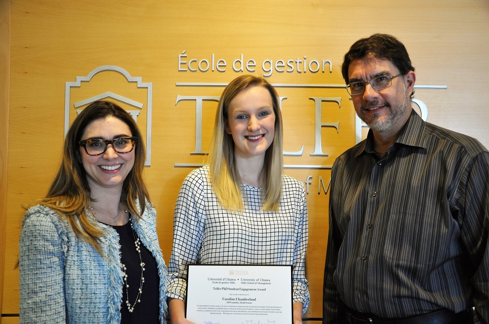 Student with PhD prgoram director and the Telfer School Dean