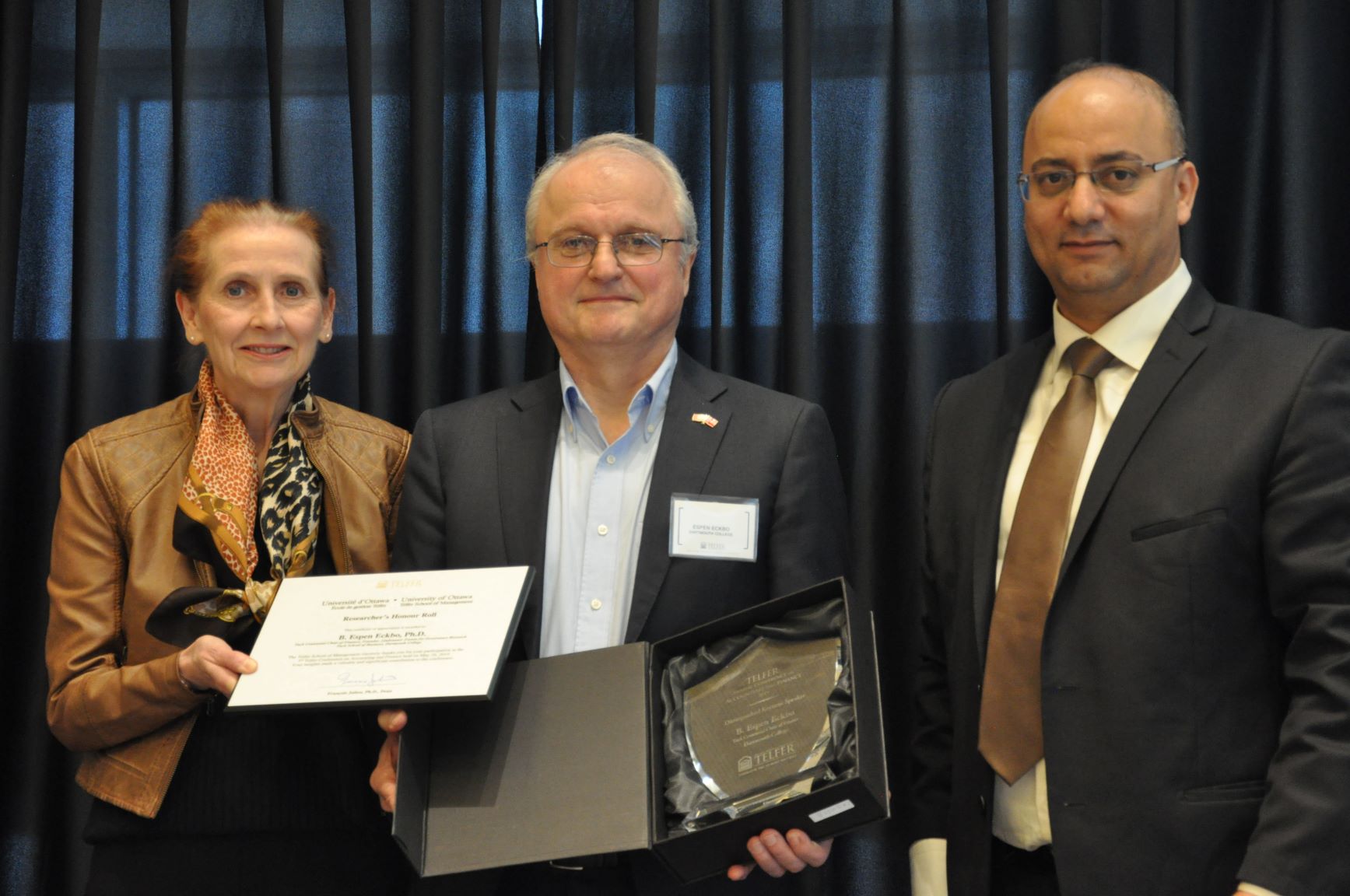 Professor Espen Eckbo and conference chairs