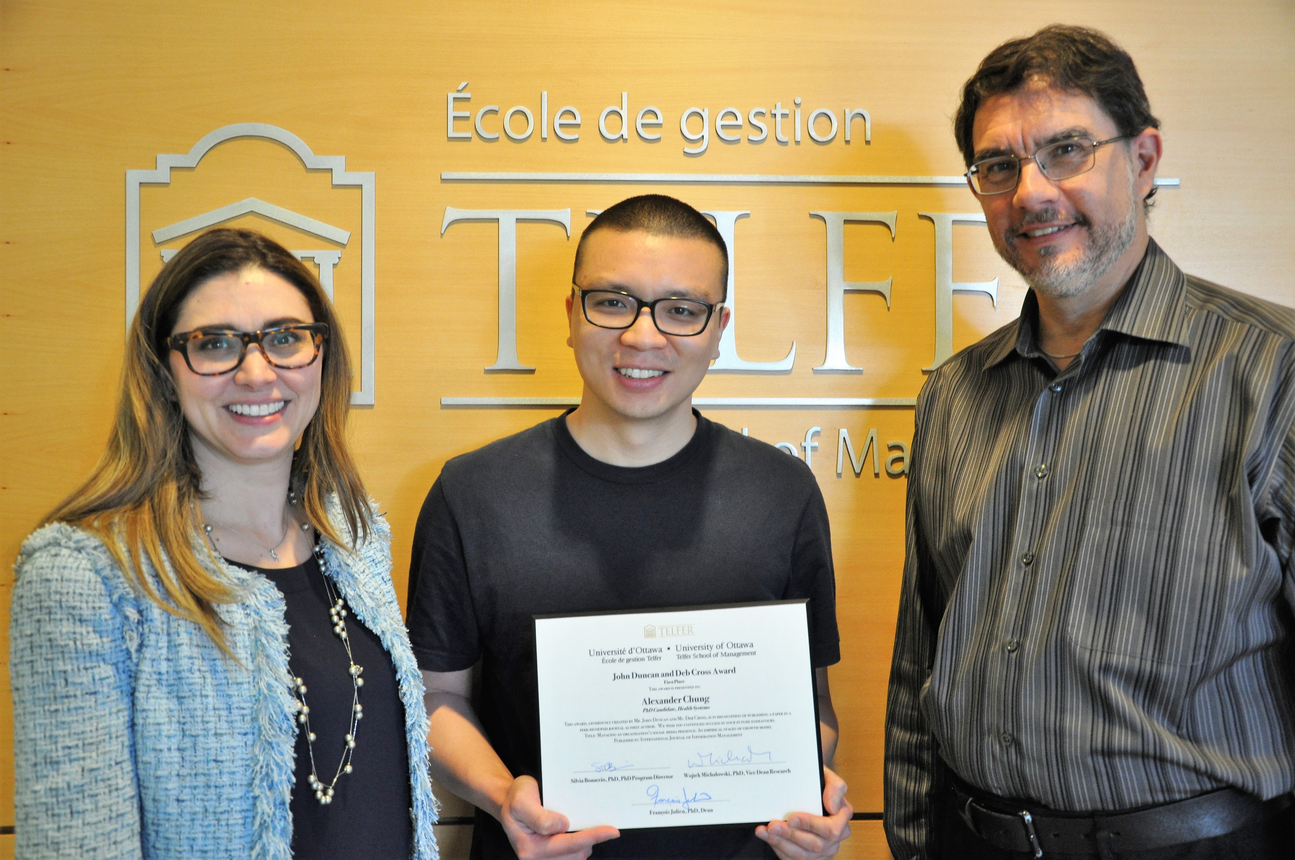 Alexander, the PhD program director, and the Telfer School Dean