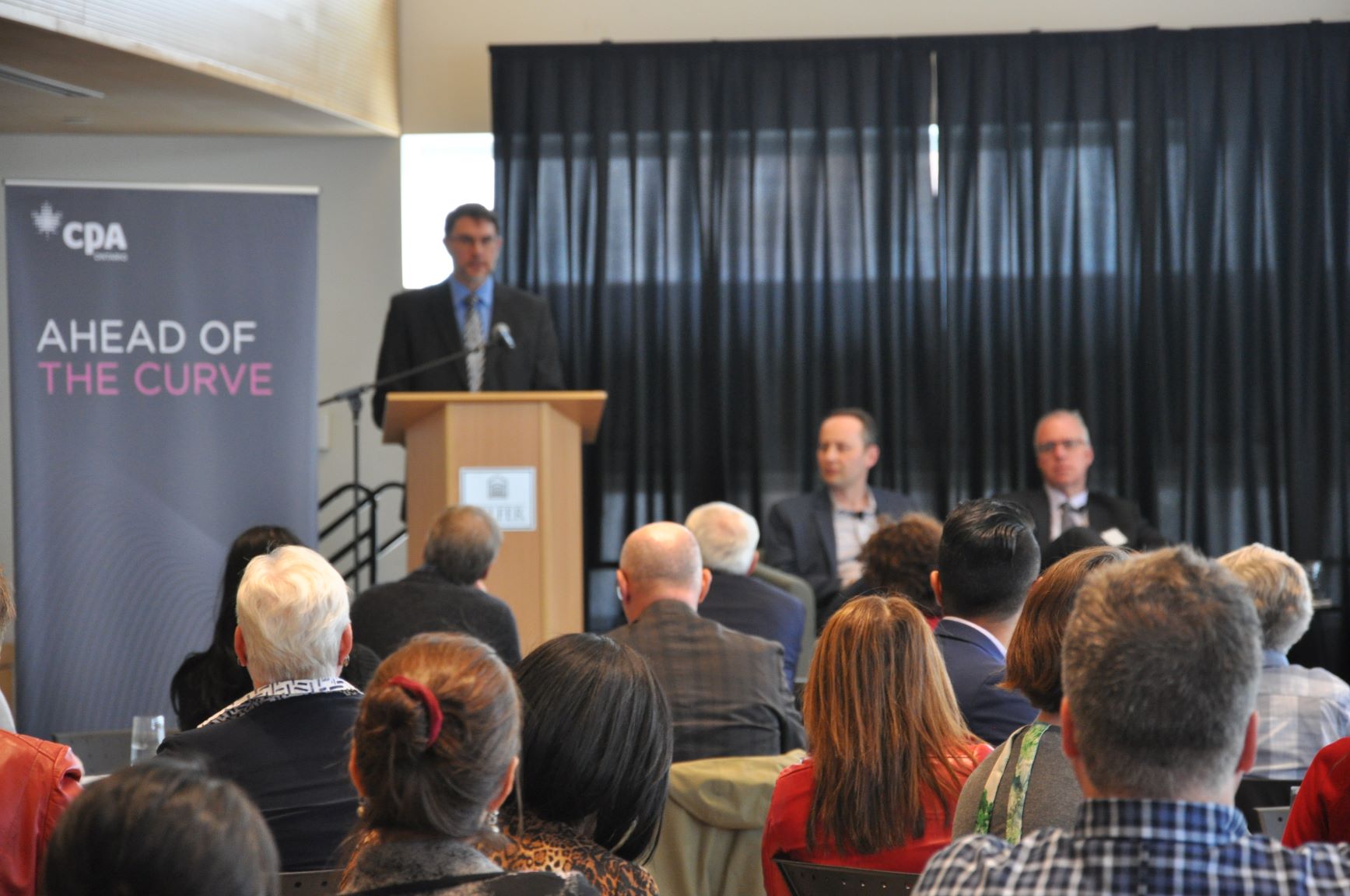 Dean at the Telfer School of Management and panelists